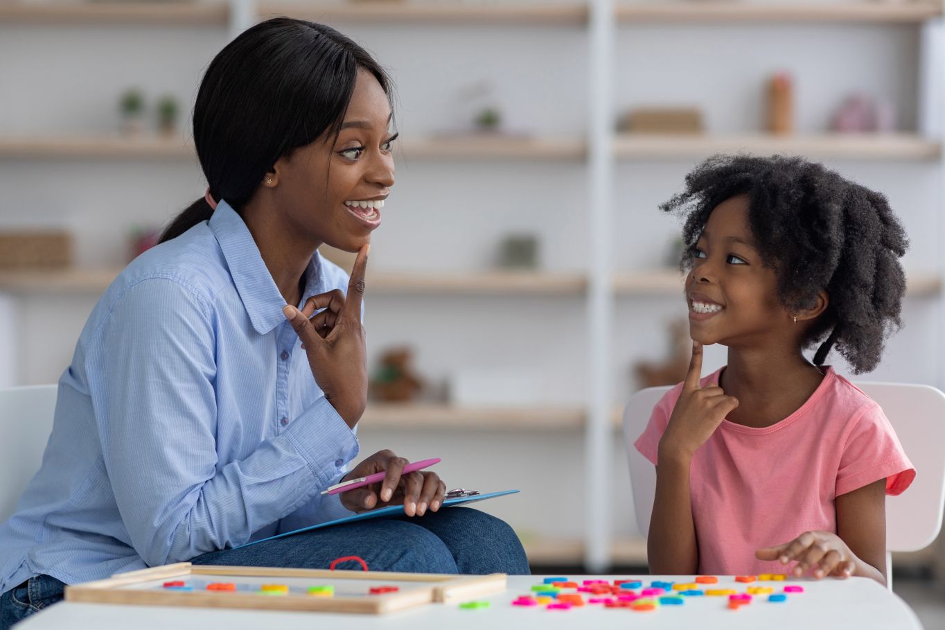 child with speech therapist
